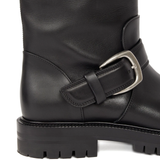 Close up of black boots showing texture of the leather fabric