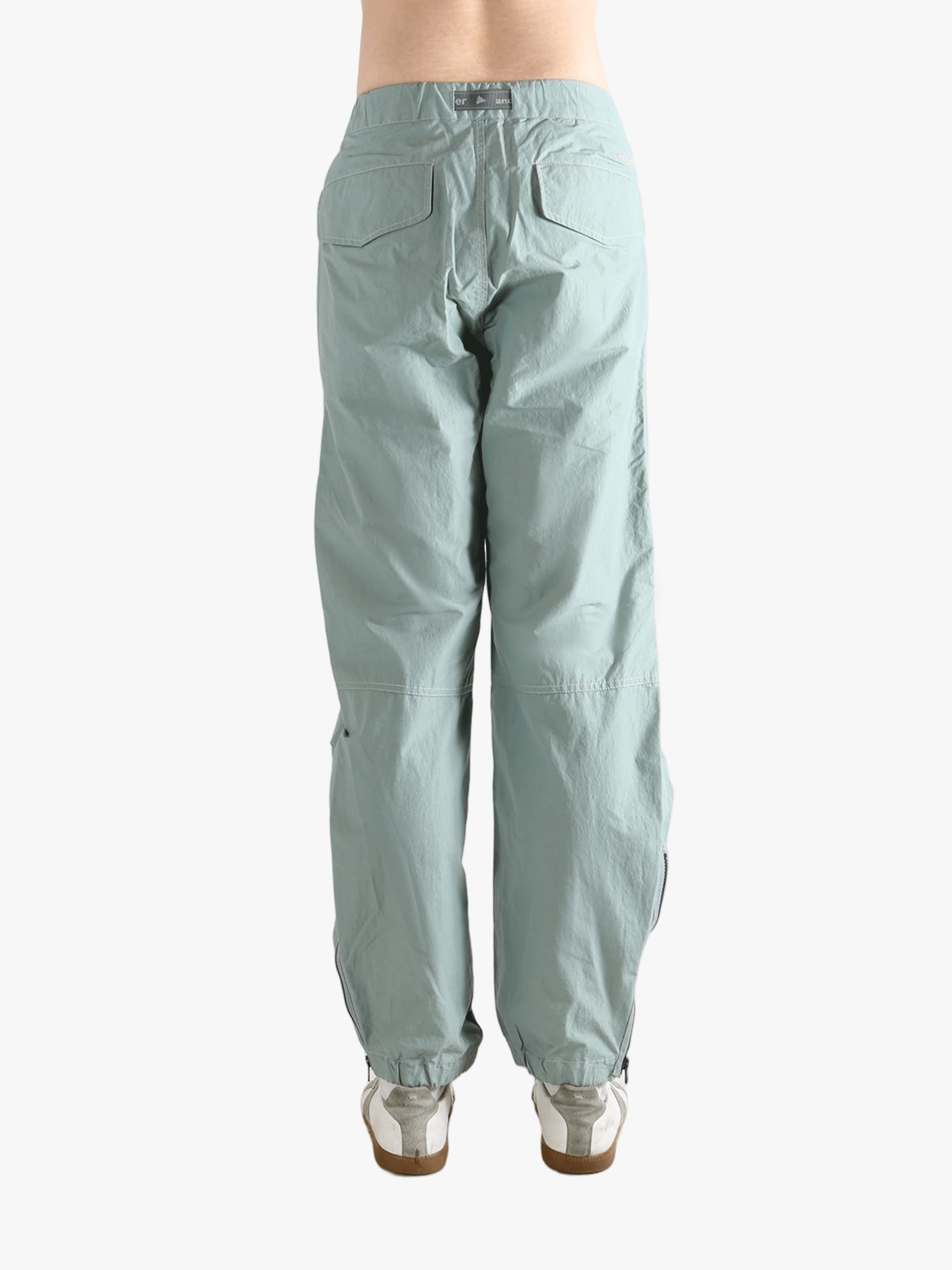 Blue pants worn by a person, showing the pants's fit