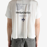 White t-shirt worn by a person, showing the t-shirt's fit