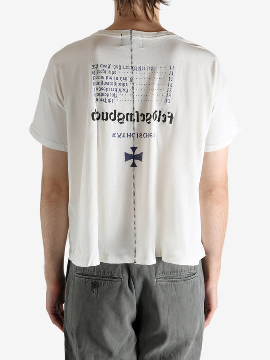 White t-shirt worn by a person, showing the t-shirt's fit