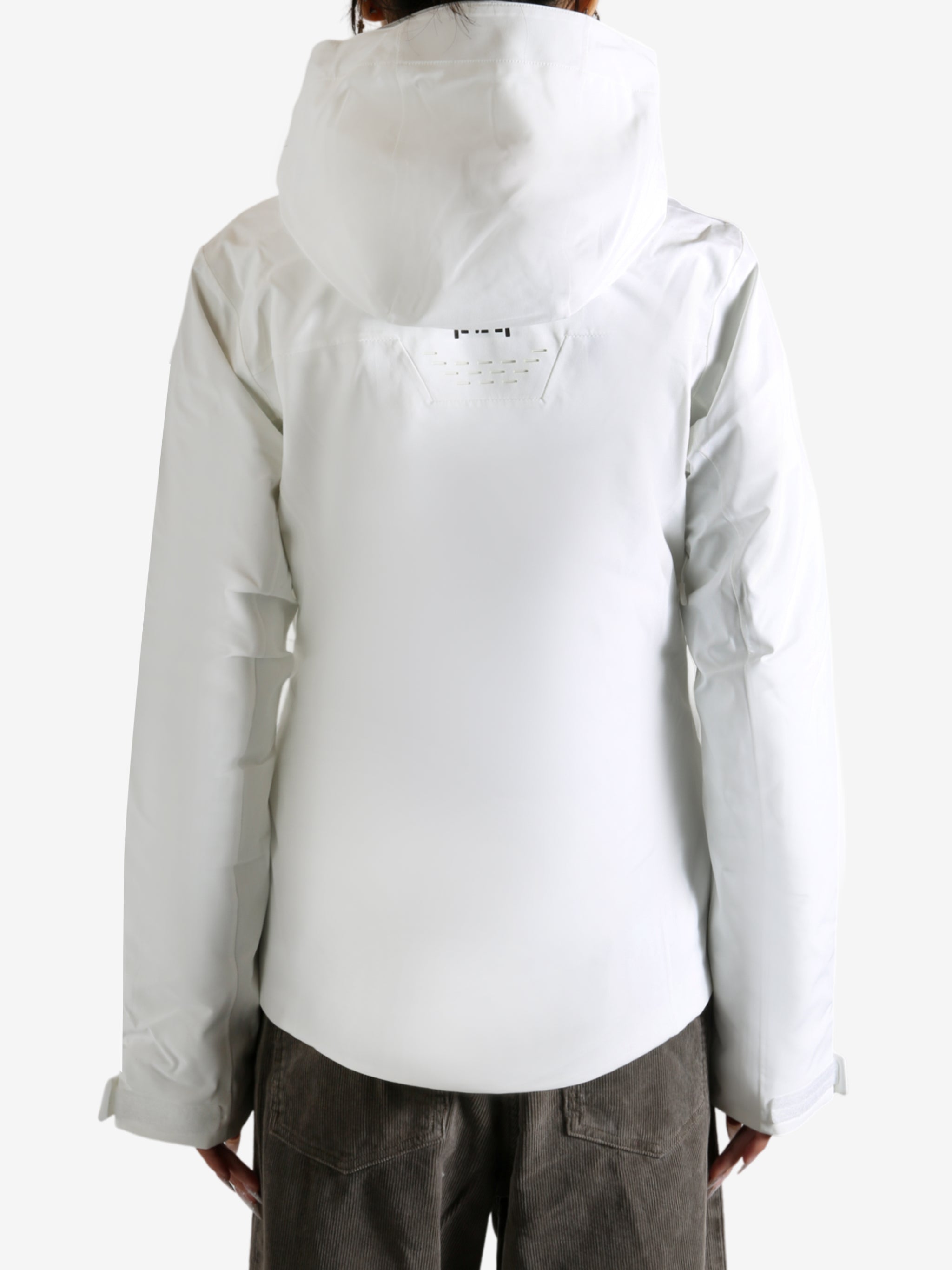 White jacket worn by a person, showing the jacket fit