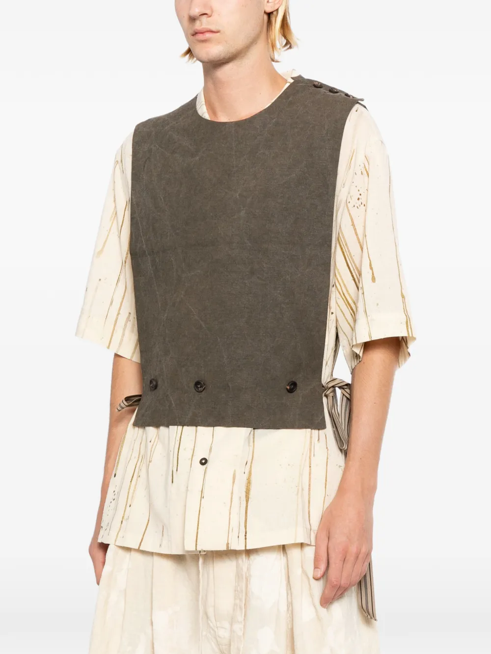 Brown vest worn by a person, showing the vest's fit