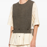 Brown vest worn by a person, showing the vest's fit