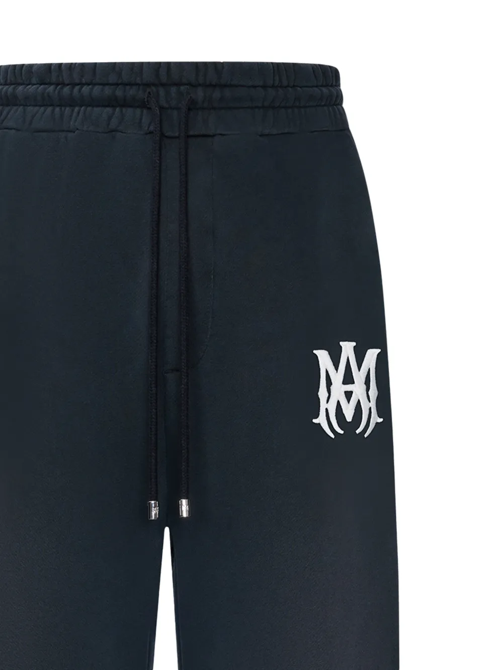 close up of black pants, showing texture of the cotton fabric