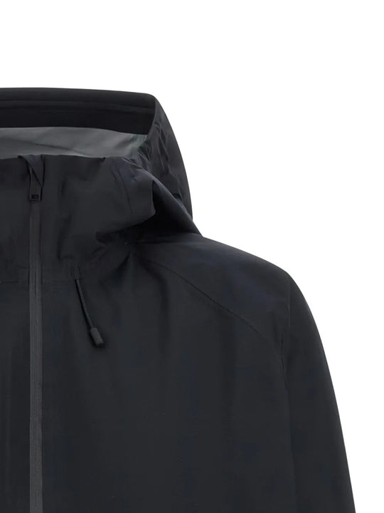 Close up of the black jacket, showing texture of the polyester fabric