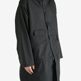 Black jackets worn by a person, showing the jacket’s fit