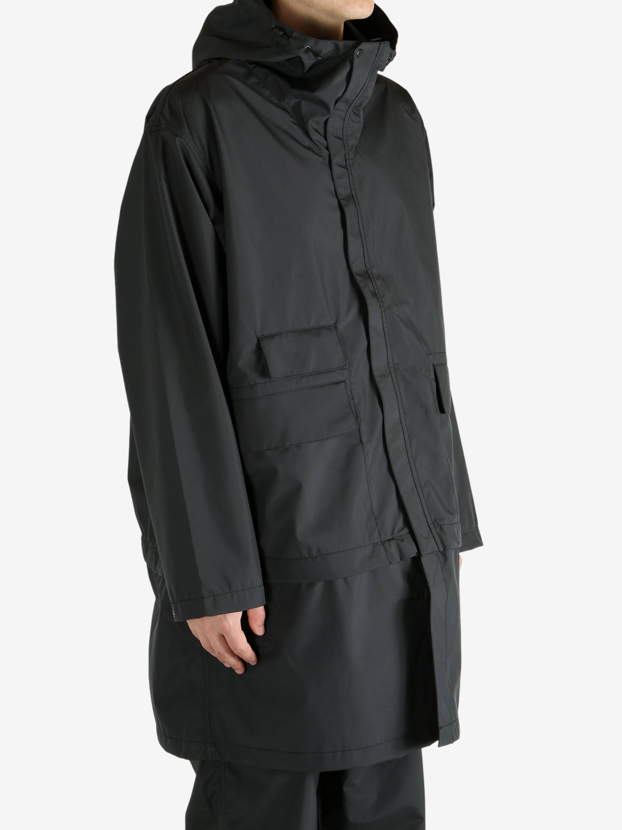 Black jackets worn by a person, showing the jacket’s fit