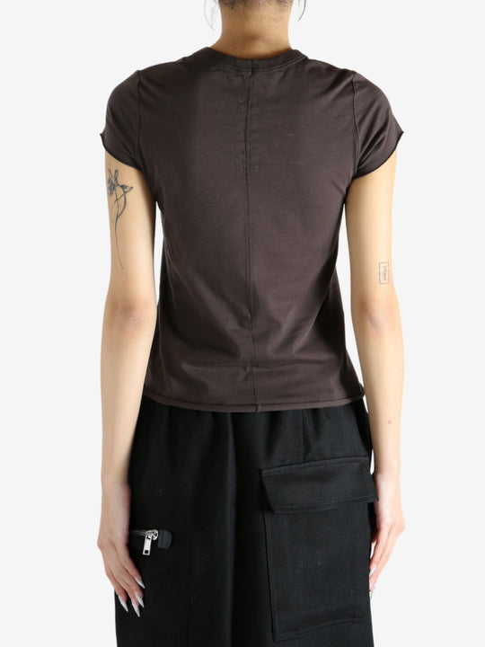 Brown shirt worn by a person, showing the shirt fit