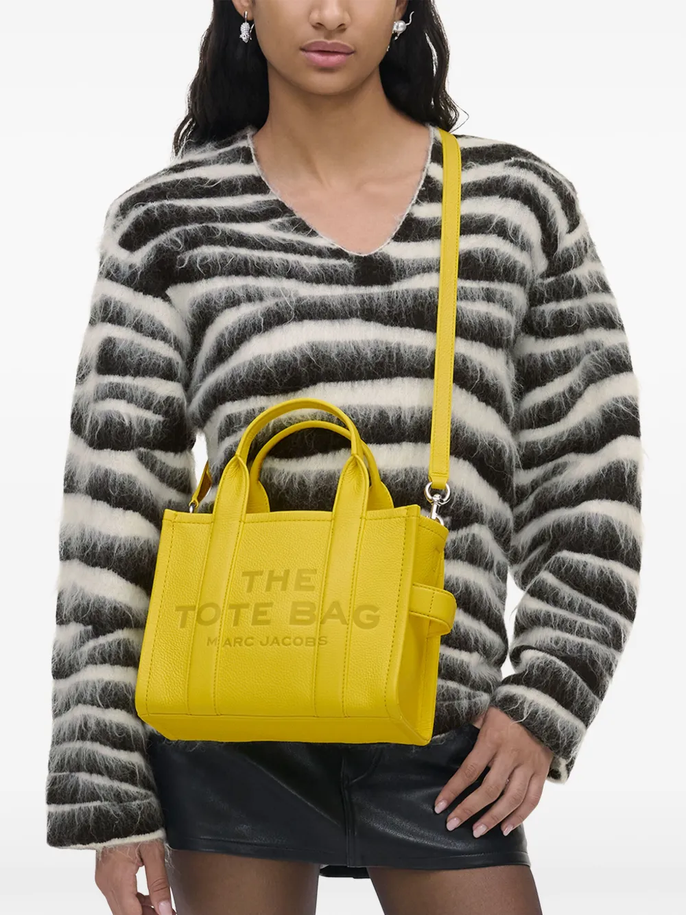 Yellow bags worn by a person, showing the bags' fit