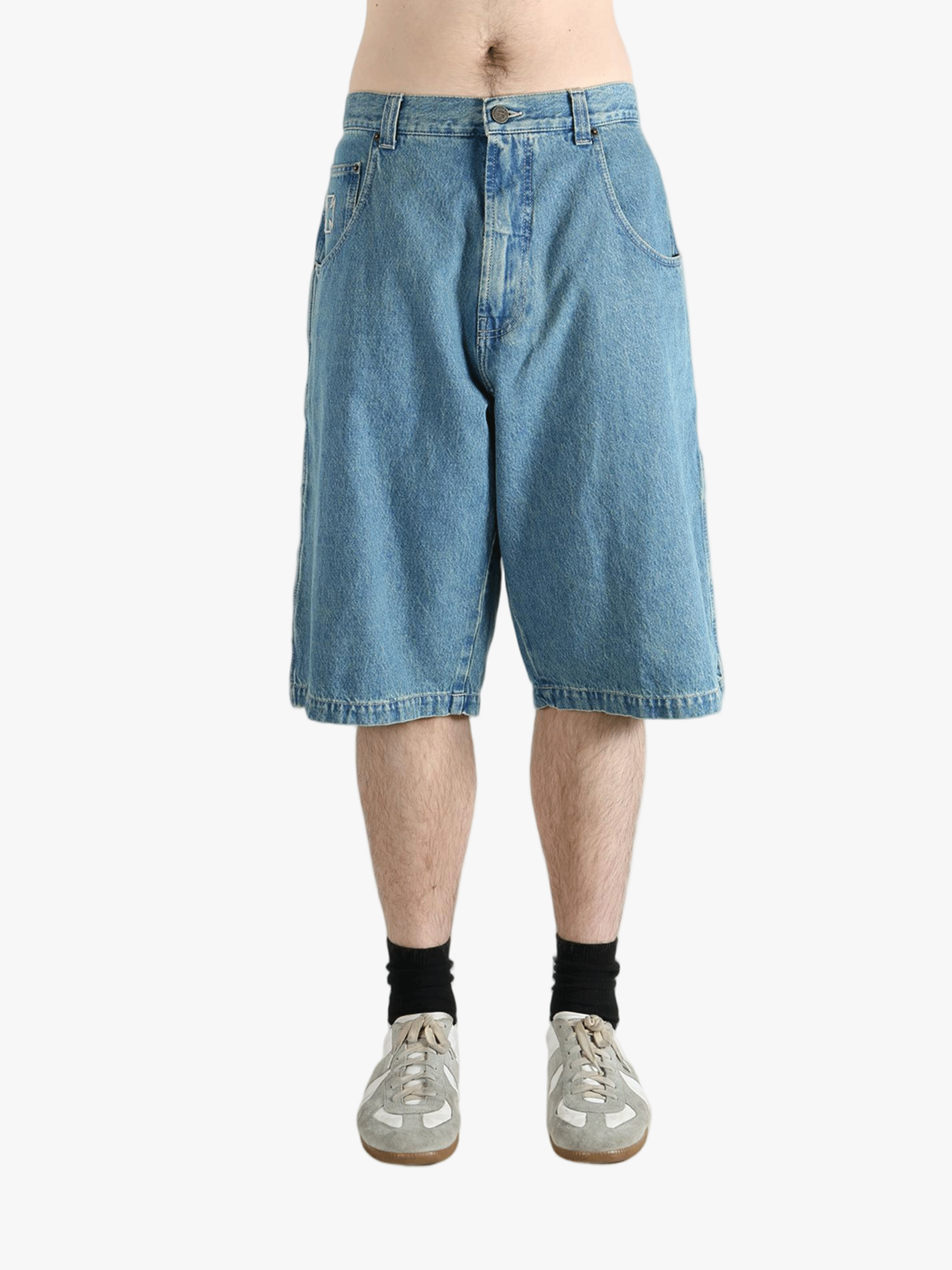 Blue short worn by a person, showing the fit