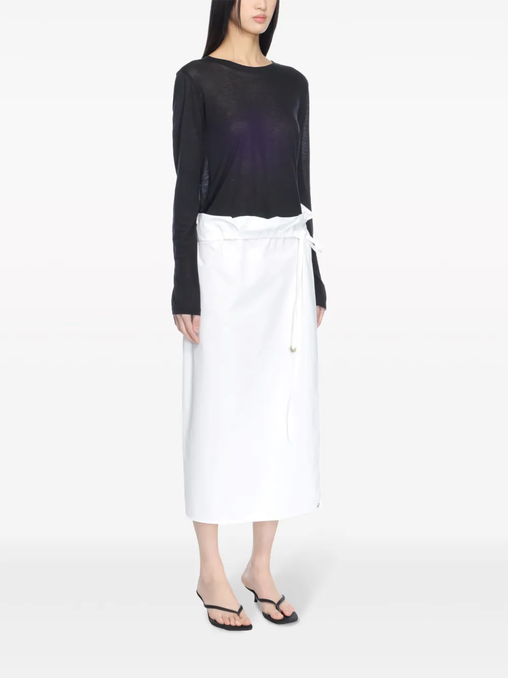 Black top worn by a person, showing the top's fit