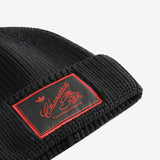 Close up of black hats, showing texture of the wool fabric