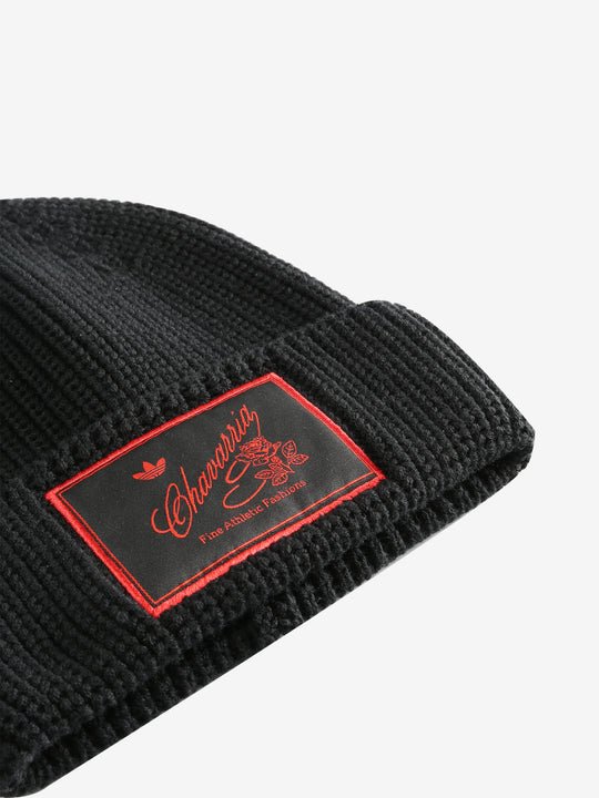 Close up of black hats, showing texture of the wool fabric