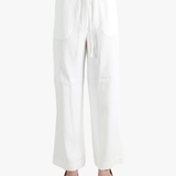 white pants worn by a person, showing the pants  fit