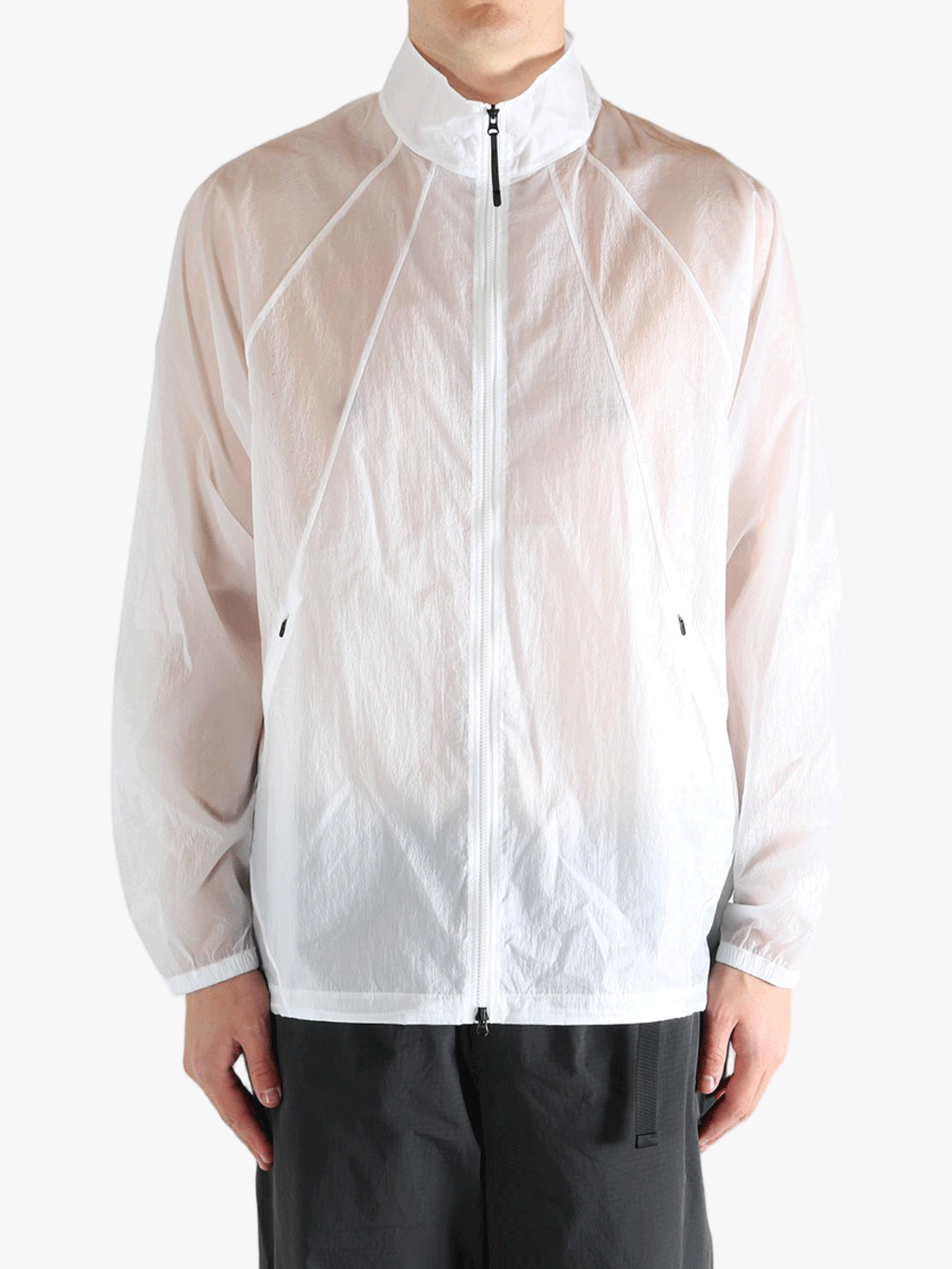 White jacket worn by a person, showing the jacket fit