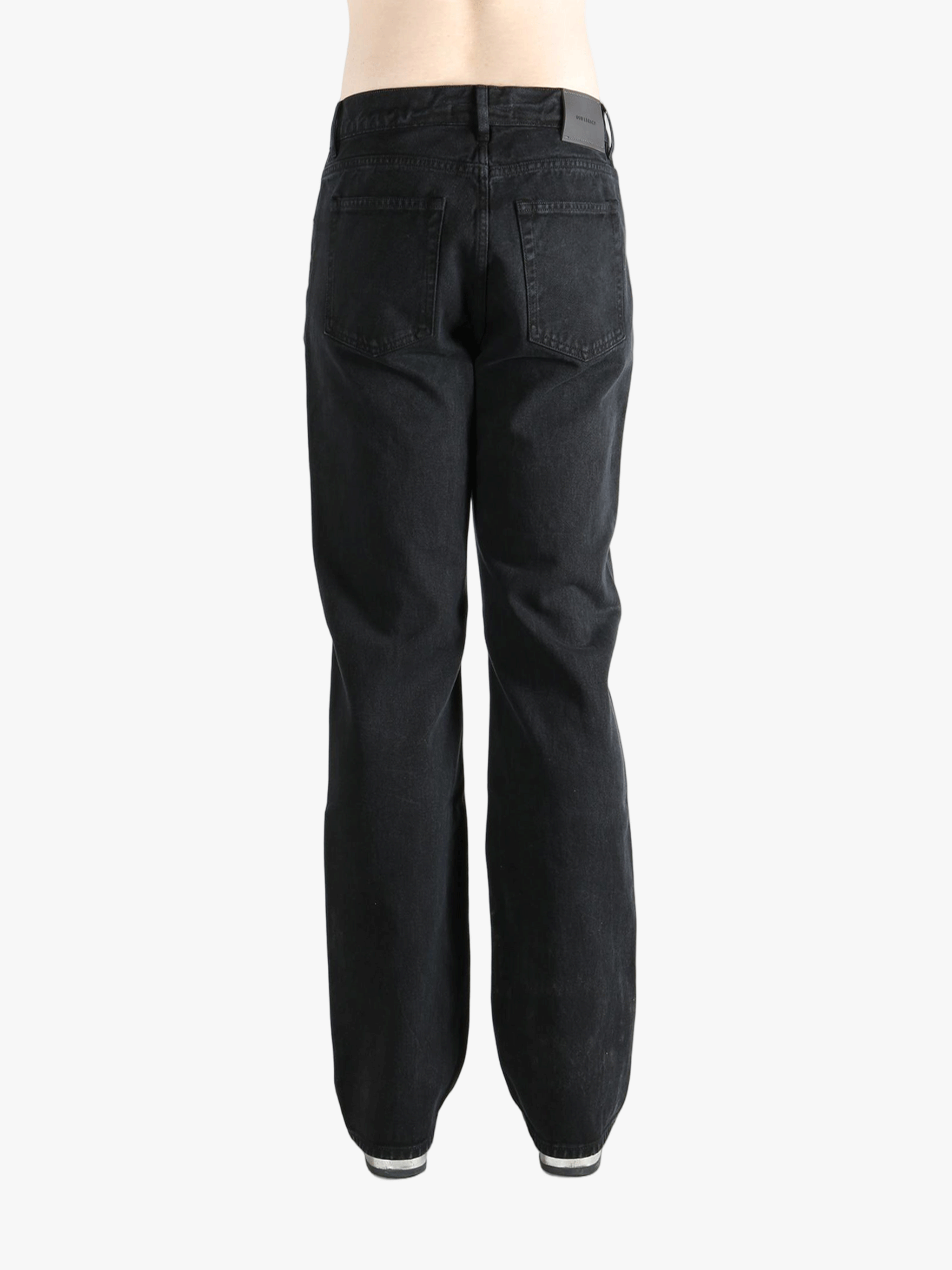 Black pant worn by a person, showing the pant's fit