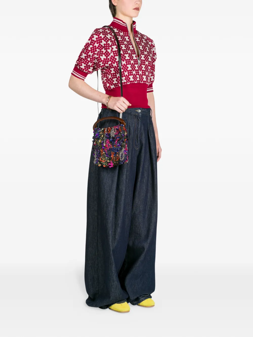 Orange bag worn by a person, showing the bag fit