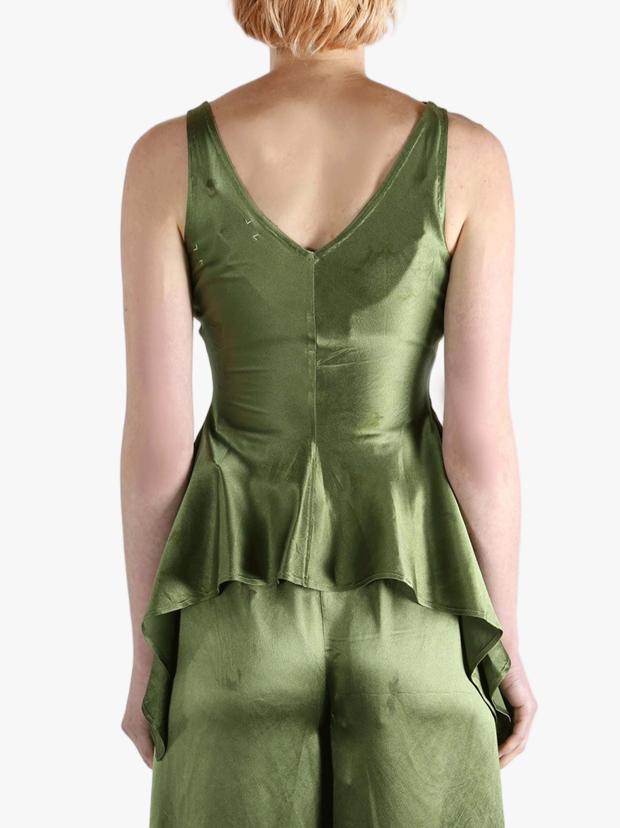 Green tops worn by a person, showing the tops fit