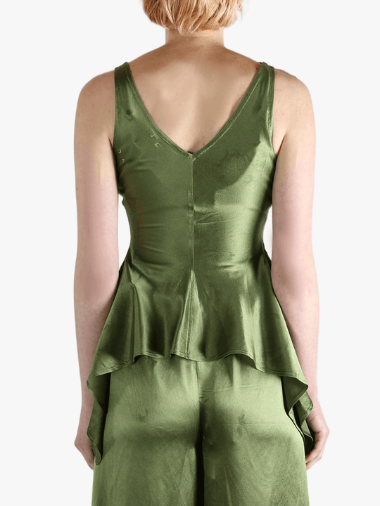 Green tops worn by a person, showing the tops fit