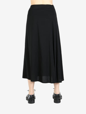 Black skirt worn by a person, showing the skirt’s fit