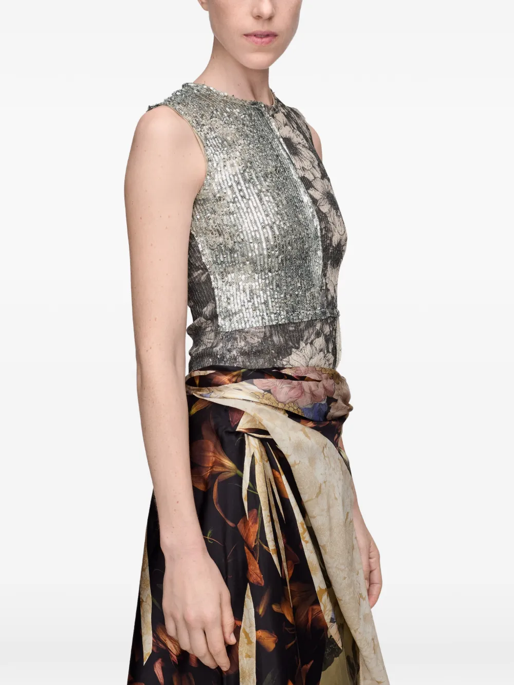 Grey tops worn by a person, showing the top's fit