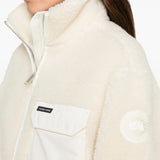 Tan hoodie worn by a person, showing the hoodie fit