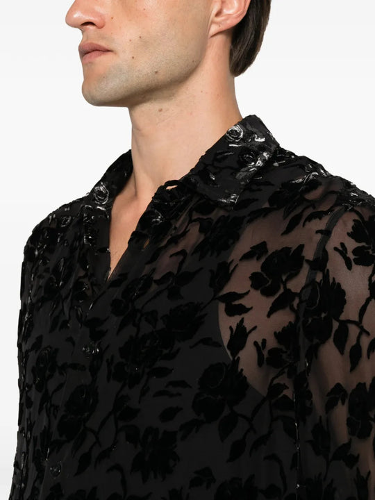 Black shirt worn by a person, showing the shirt fit