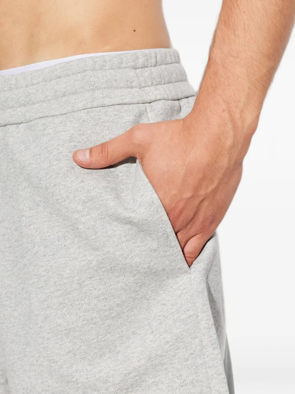 Grey pants worn by a person, showing the pants fit