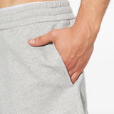 Grey pants worn by a person, showing the pants fit