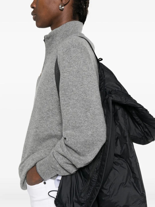 Black jacket worn by a person, showing the jacket's fit