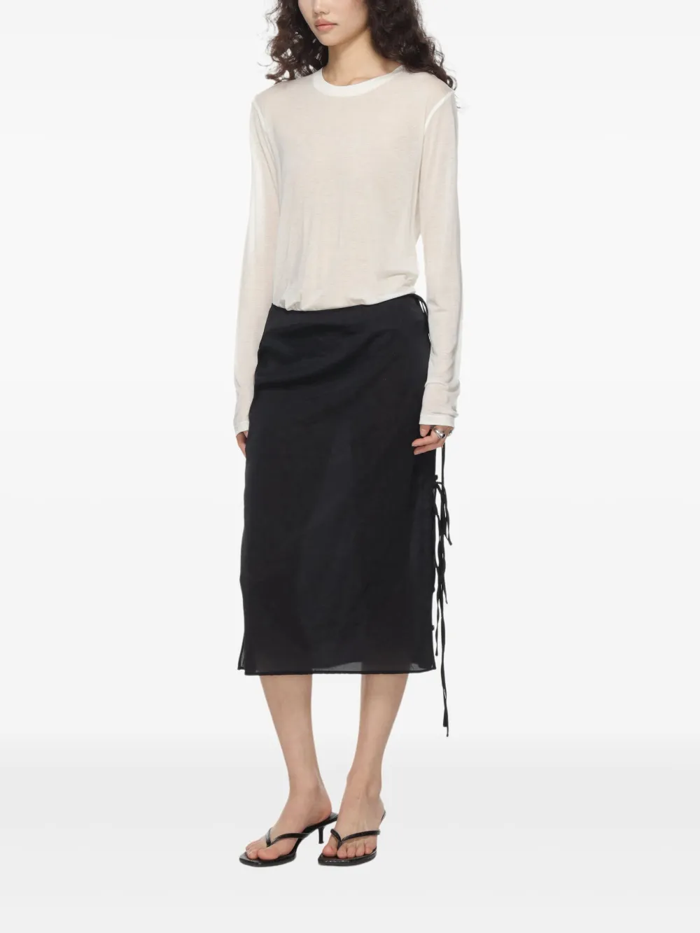 White T-shirt worn by a person, showing the T-shirt's fit