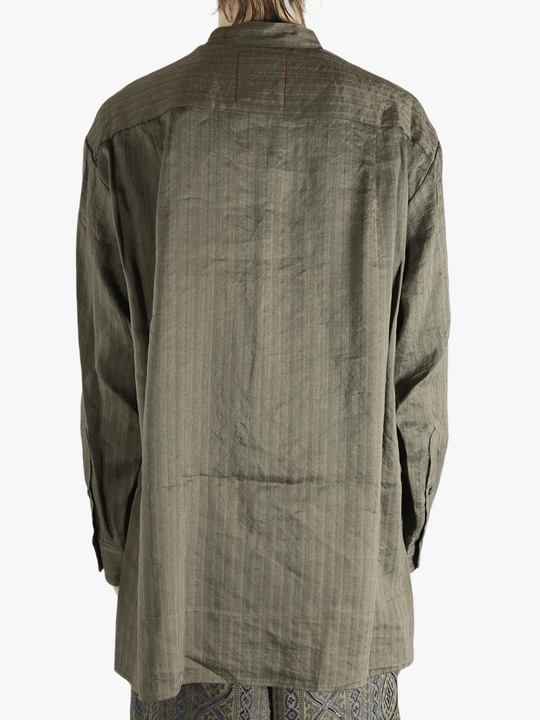 Grey top worn by a person, showing the top's fit