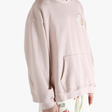 Pink hoodie worn by a person, showing the hoodie's fit