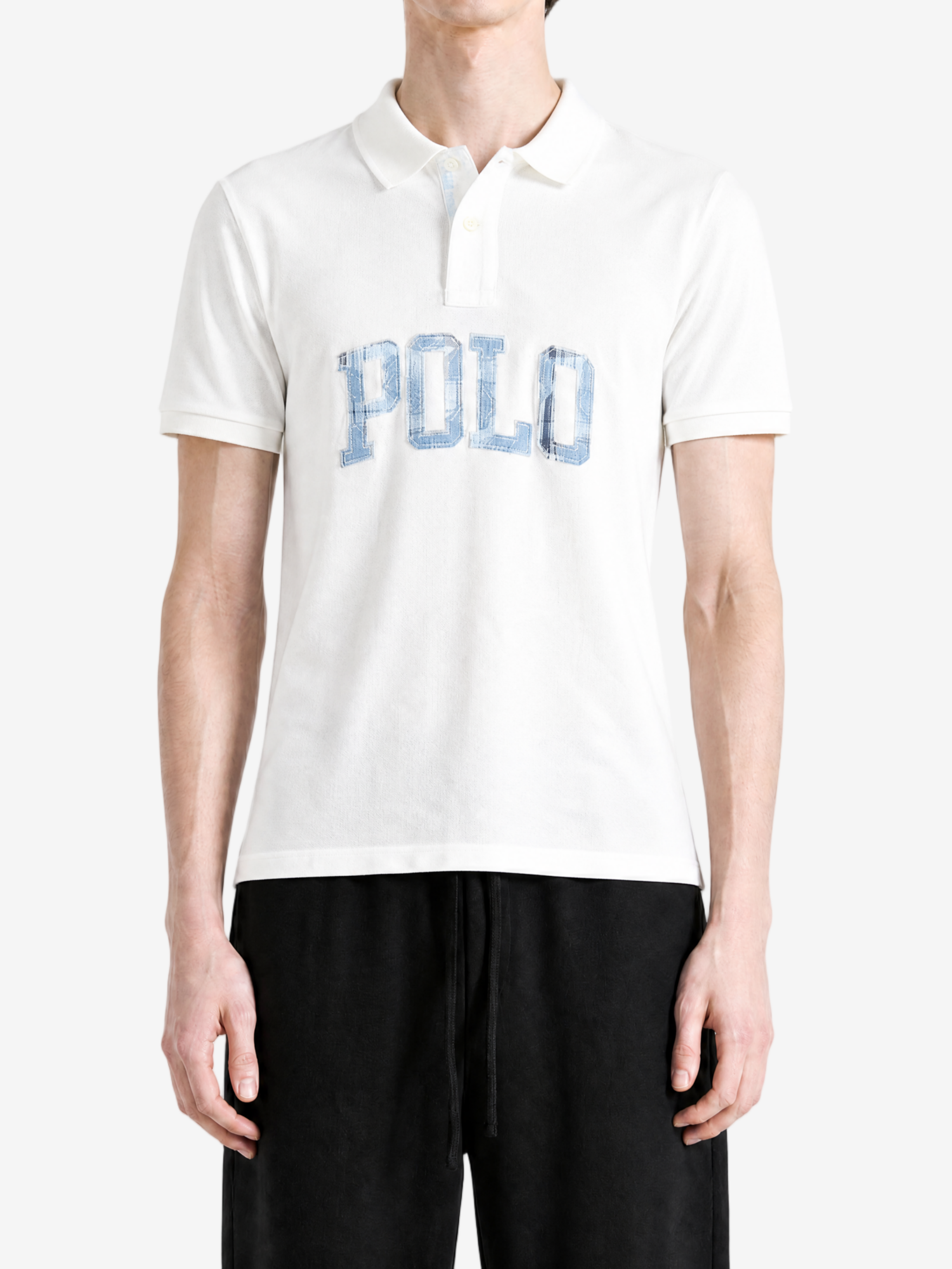 White t-shirt worn by a person, showing the t-shirt fit