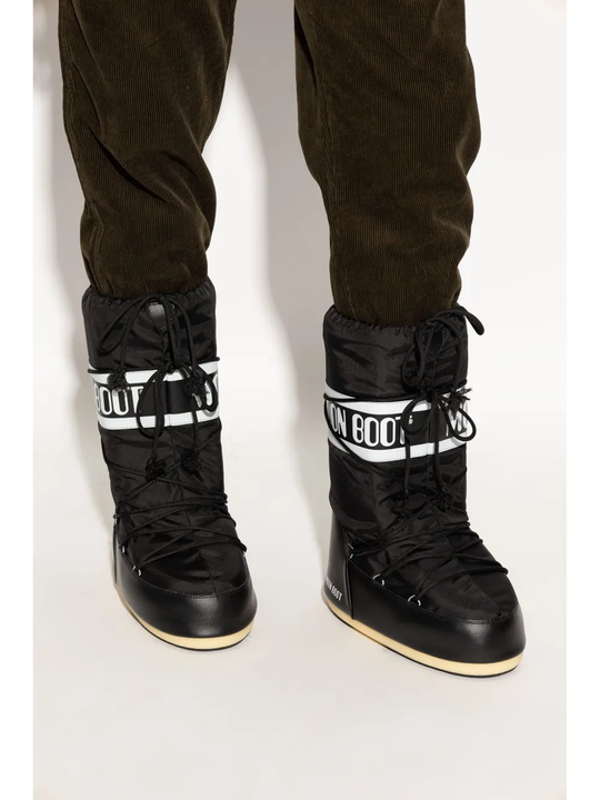 Black boot worn by a person, showing the boot's fit