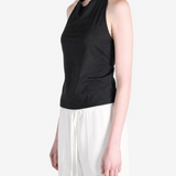 BLack tops worn a person,showing the tops fit