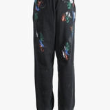 Black pants worn by a person, showing the shirt's fit