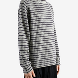 Grey top worn by a person, showing the top fit