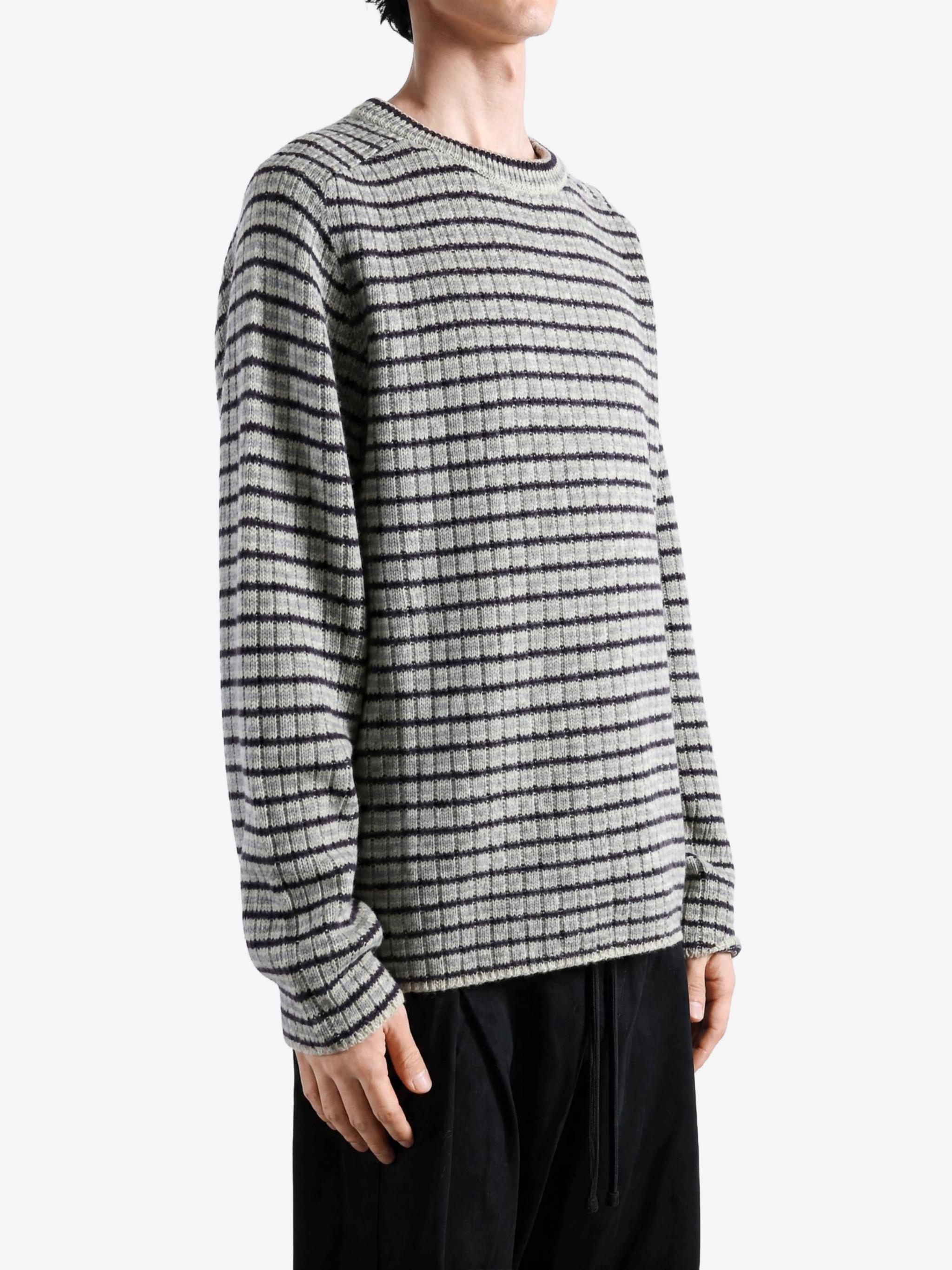 Grey top worn by a person, showing the top fit