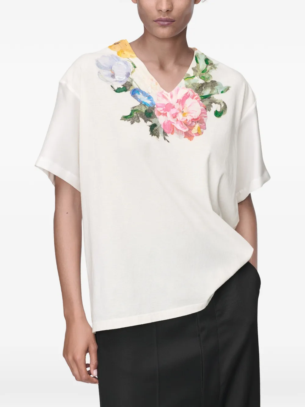 White t-shirt worn by a person, showing the t-shirt's fit