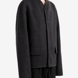 Black jacket worn by a person, showing the jacket fit