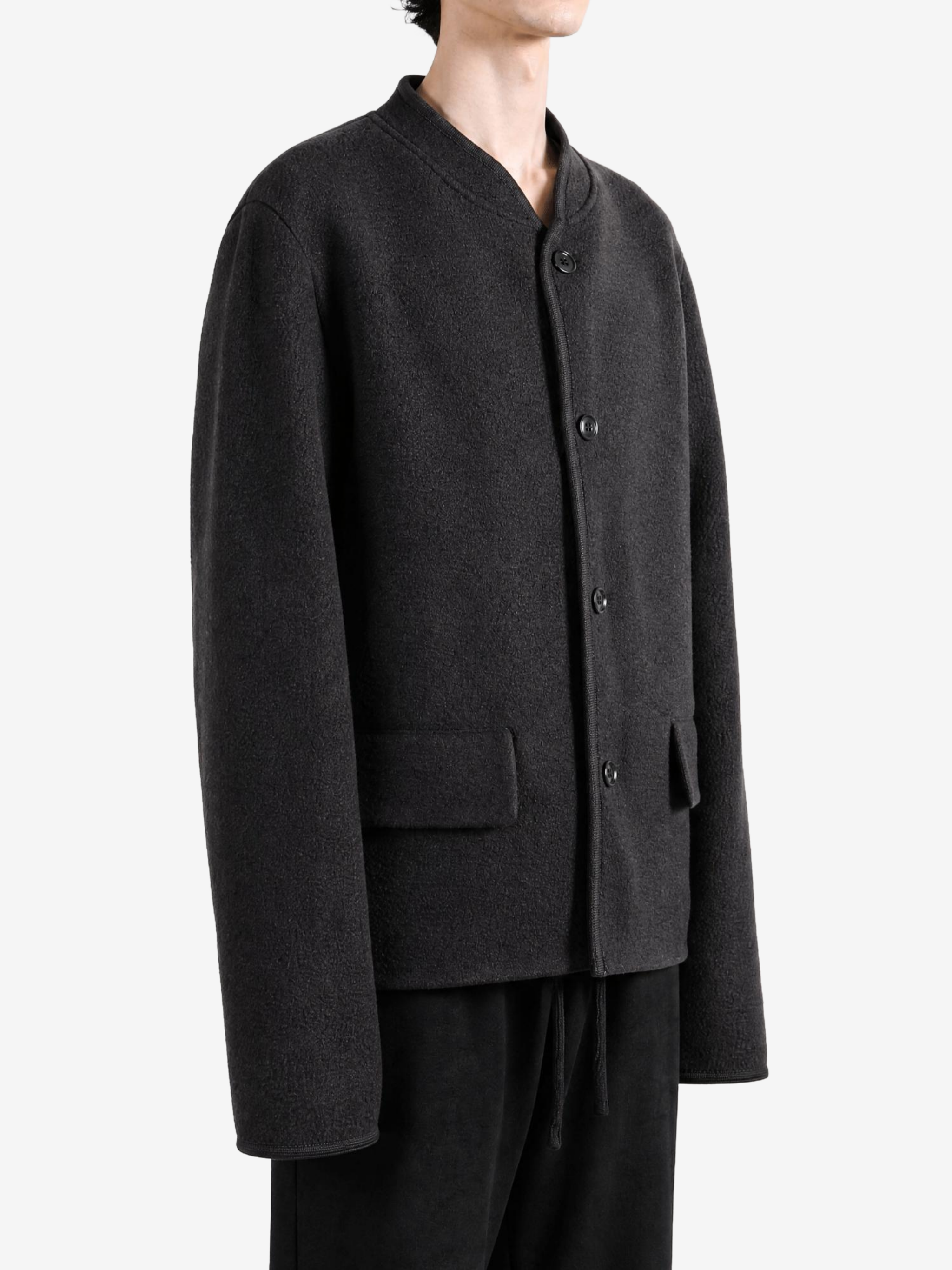 Black jacket worn by a person, showing the jacket fit