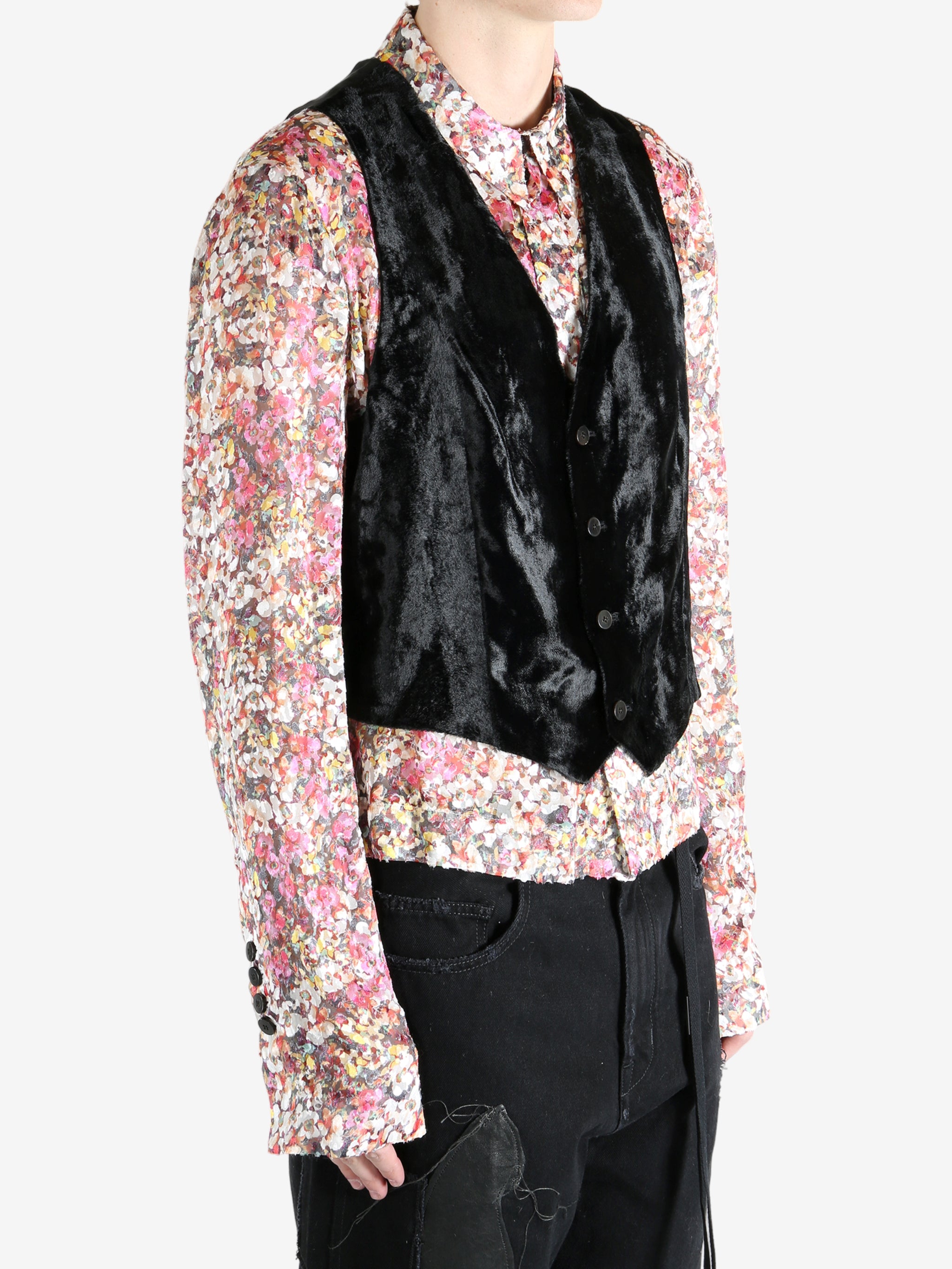 Black top worn by a person, showing the top's fit