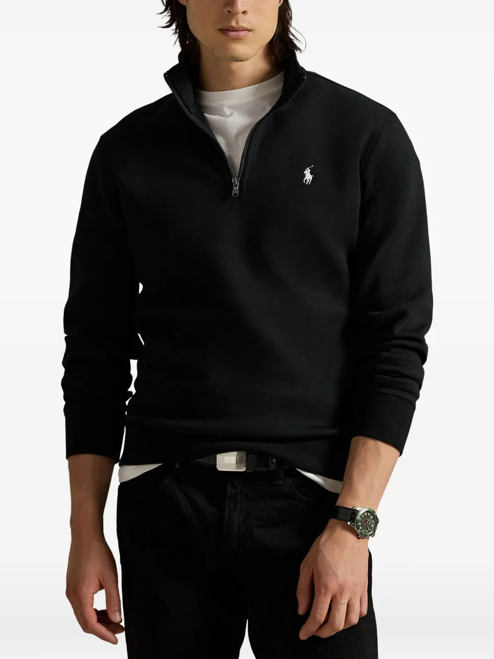 Black knitwear worn by a person, showing the knitwear fit