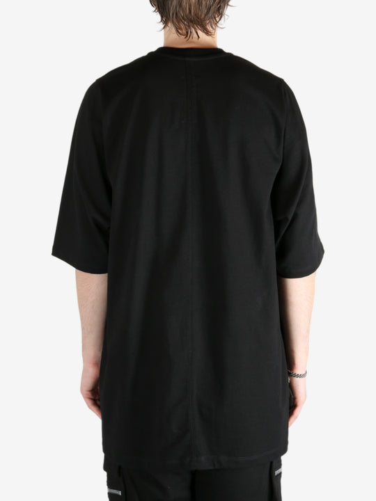 Black shirt worn by a person, showing the shirt's fit