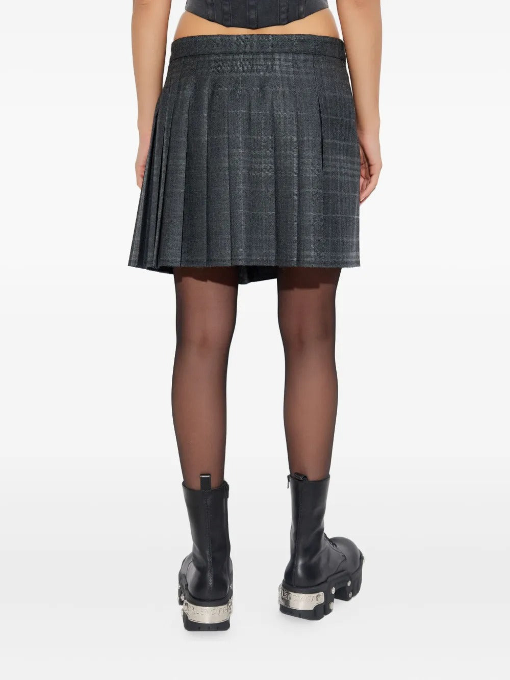 Grey skirt worn by a person, showing the skirt's fit