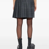 Grey skirt worn by a person, showing the skirt's fit