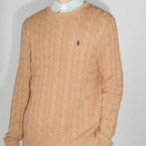 Orange sweater worn by a person, showing the sweater fit