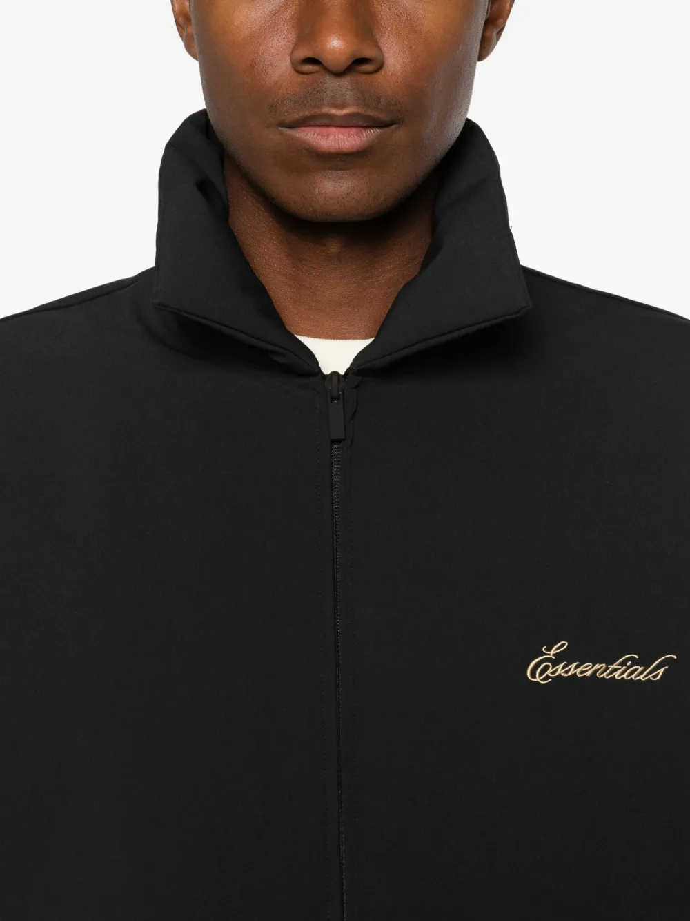Close up of black coats, showing texture of the blended fabric