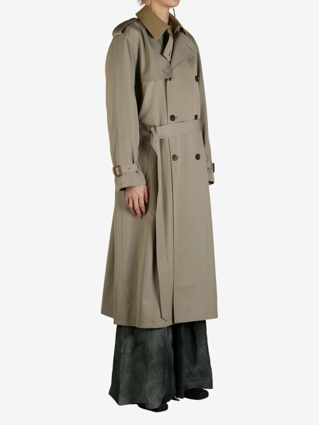 Tan coat worn by a person, showing the coat's fit